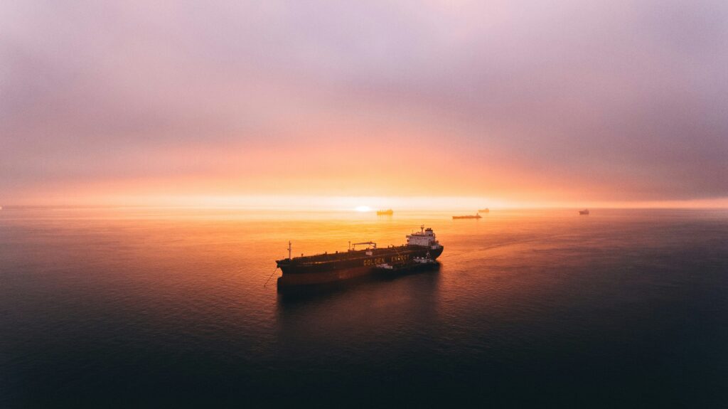 Transport ship against sunset