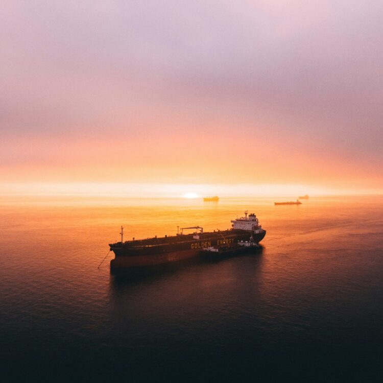 Transport ship against sunset